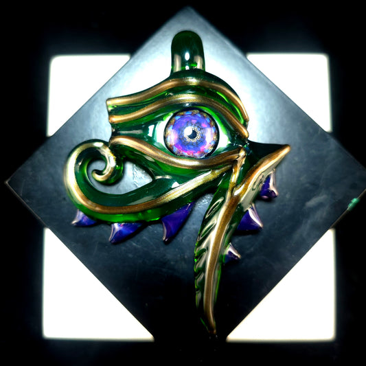 Plantfibian eye of Ra pendant with electrum outline