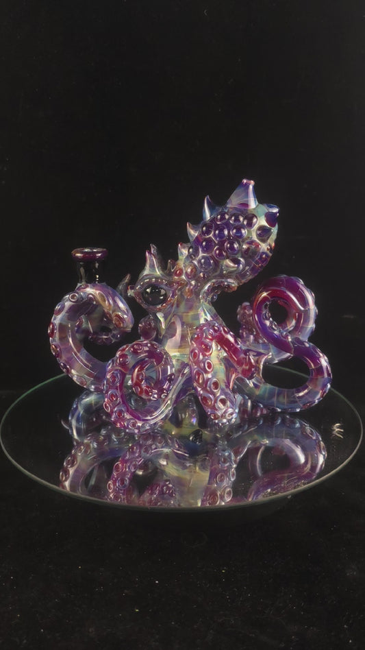 Amber purple octopus with opal eyes!